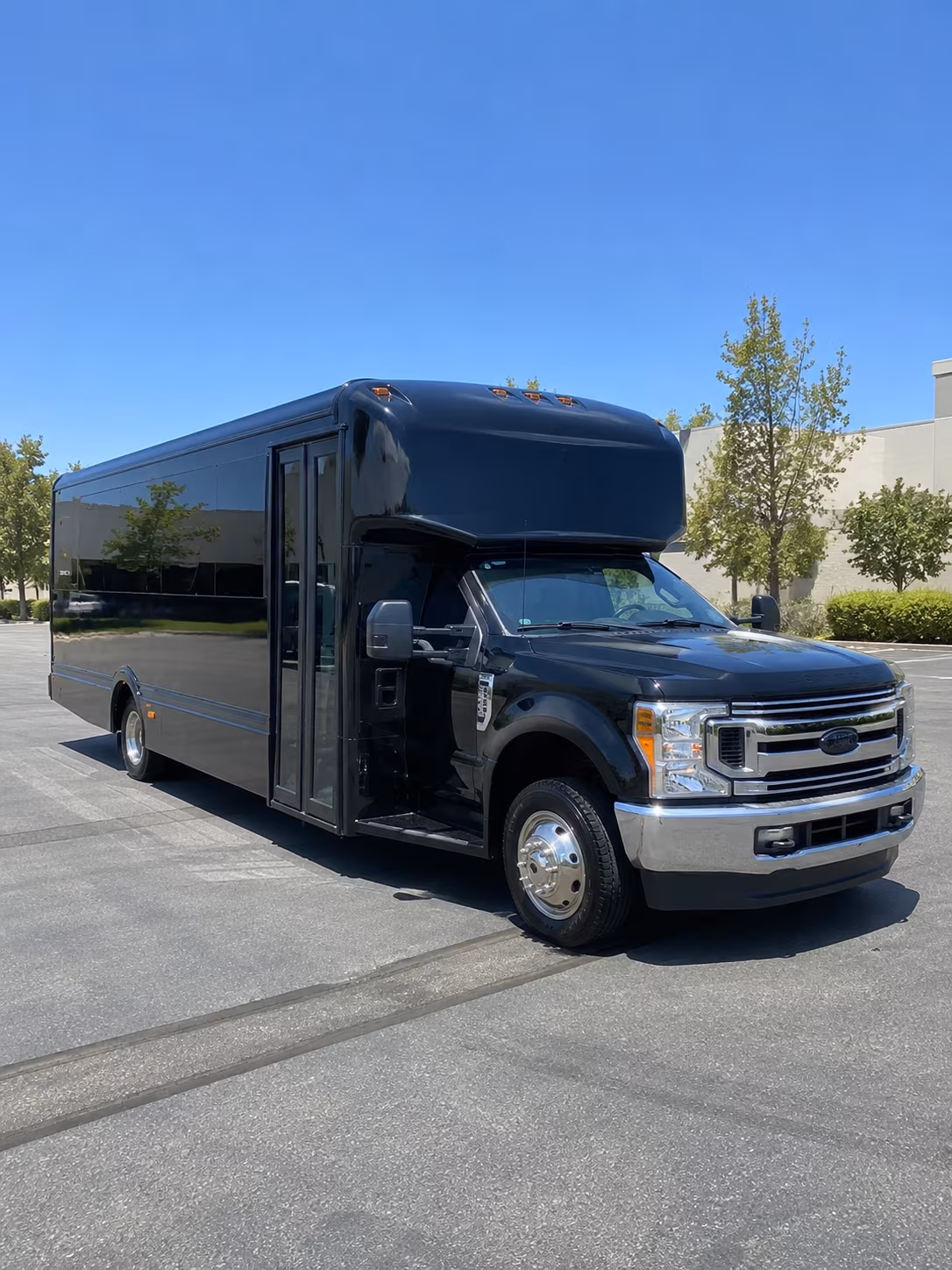Group beside a Mercedes Sprinter limo in Fayetteville